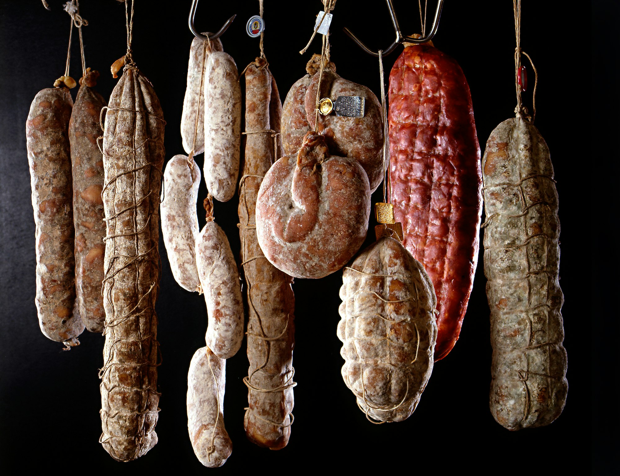 Row of hanging salamis
